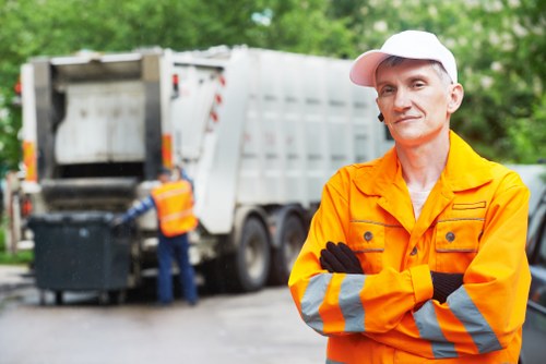 Professional team performing builders waste clearance